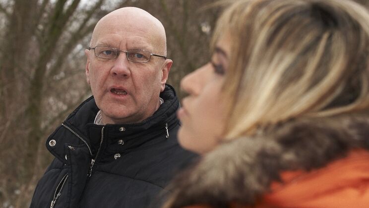 Old and Young Lovers Kiss in Snowy Forest