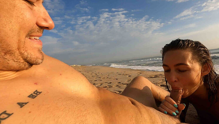Amelia Sucks Diego in the Open on the Beach